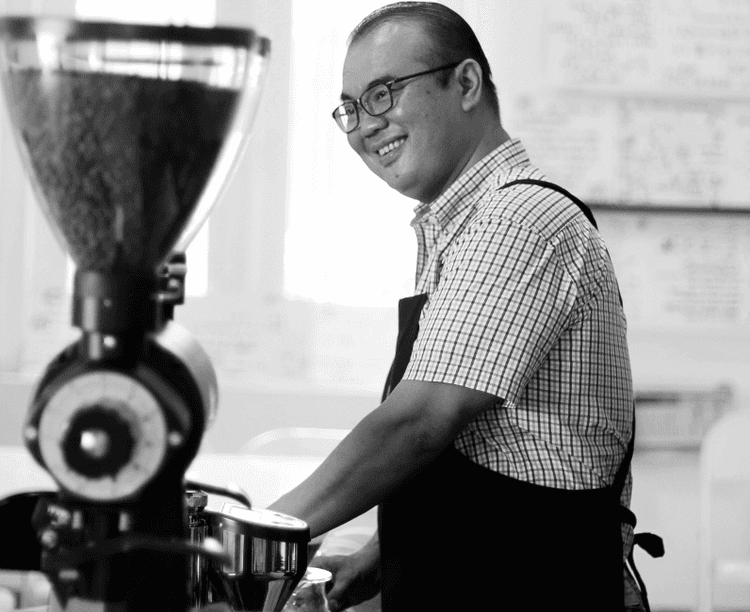 barista with coffee beans